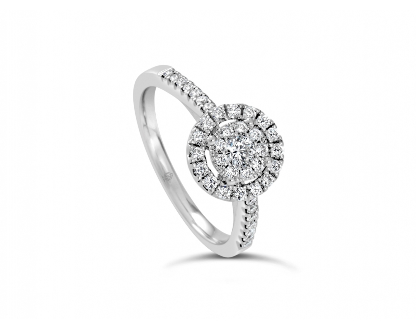 18k white gold halo illusion set engagement ring with pave set sidestones